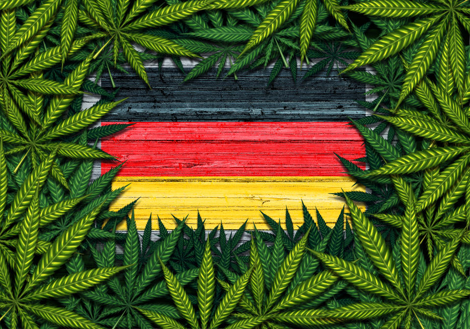 Germany marijuana and German cannabis symbol with the flag on rustic wood with leaves as a border in a 3D illustration style.