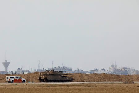 An Israeli tank is seen near what the Israeli forces said was a "significant" cross-border attack tunnel from the Gaza Strip, which was being dug by the enclave's dominant Islamist group, Hamas, near Israel's border with the Gaza Strip December 10, 2017. REUTERS/Amir Cohen