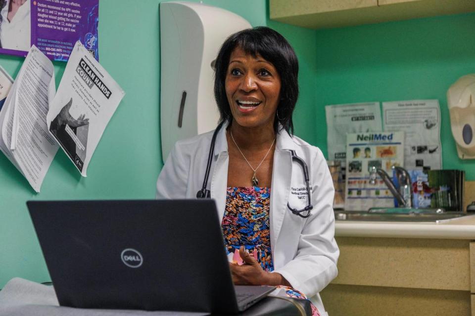 Dr. Tina Carroll-Scott talks to the parents of patient Dillon Burkhalter, 21 m.o. during a visit to her office at the South Miami Children’s Clinic, on Wednesday, October 04, 2023.