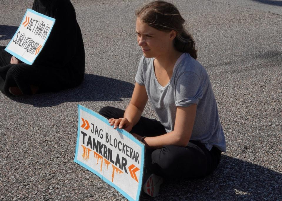 Greta Thunberg pictured blockading a harbour in Malmo in climate change protest (REUTERS)