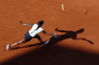 FILE - In this May 31, 2019, file photo, Sloane Stephens of the United States plays a shot against Slovenia's Polona Hercog during their third round match of the French Open tennis tournament at Roland Garros stadium in Paris. (AP Photo/Pavel Golovkin, File)