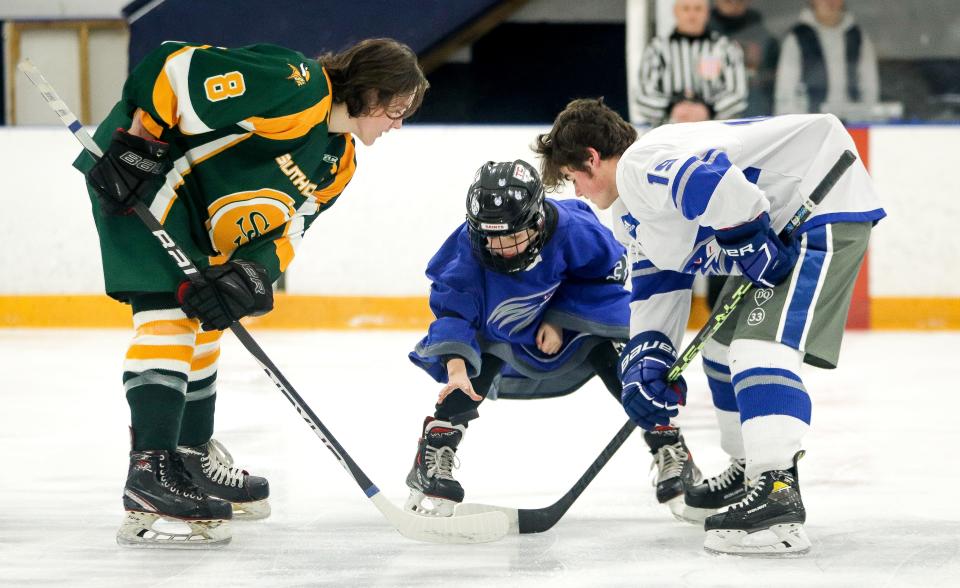 Connor Quinn, 11, younger brother of Dylan Quinn, does the ceremonial puck drop as the Southeastern/Bristol-Plymouth hockey team played South Shore Tech at Raynham IcePlex on Saturday, Jan. 21, 2023.