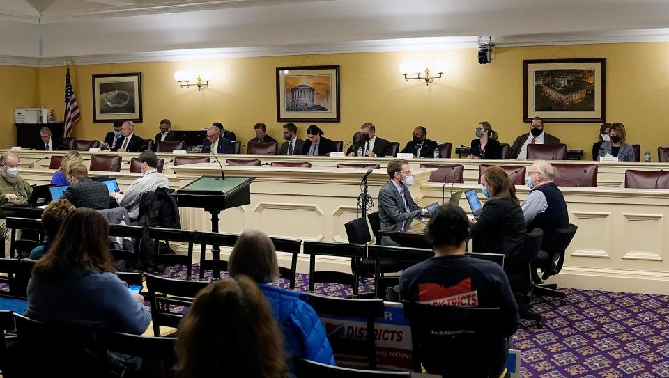 Governor Mike DeWine, left, speaks during an Ohio Redistricting Commission meeting at the Ohio Statehouse in Columbus, Ohio on January 18, 2022. 