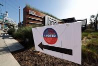 An Uber logo and a "I voted" sign are seen in Redondo Beach, Los Angeles