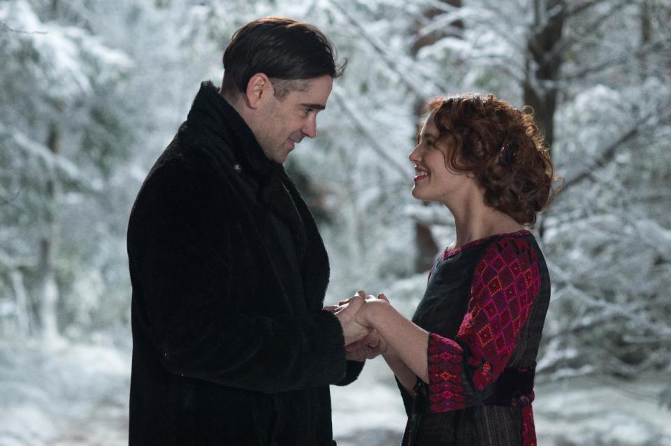 This image released by Warner Bros. shows Jessica Brown Findlay, right, and Colin Farrell in a scene from "Winter's Tale." (AP Photo/Warner Bros., David C. Lee)