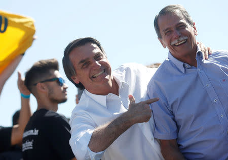 Presidential candidate Jair Bolsonaro (L) and Paulo Chagas, retired General of the Brazilian Army, attend a rally in Taguatinga near Brasilia, Brazil September 5, 2018. Picture taken September 5, 2018. REUTERS/Adriano Machado