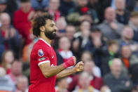 Liverpool's Mohamed Salah celebrates after scoring his side's third goal during the English Premier League soccer match between Liverpool and Nottingham Forest, at Anfield in Liverpool, England, Sunday, Oct. 29, 2023. (AP Photo/Jon Super)