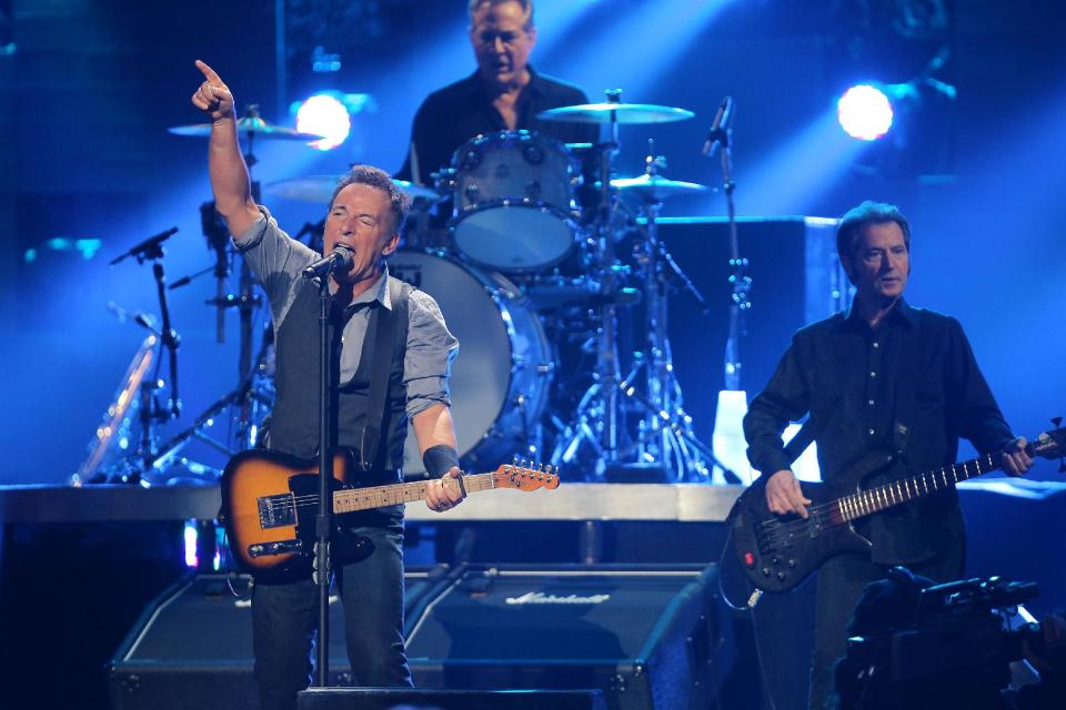 In this image released by Starpix, Bruce Springsteen and the E street Band perform at 12-12-12 The Concert for Sandy Relief at Madison Square Garden in New York on Wednesday, Dec. 12, 2012. (AP Photo/Starpix, Dave Allocca)