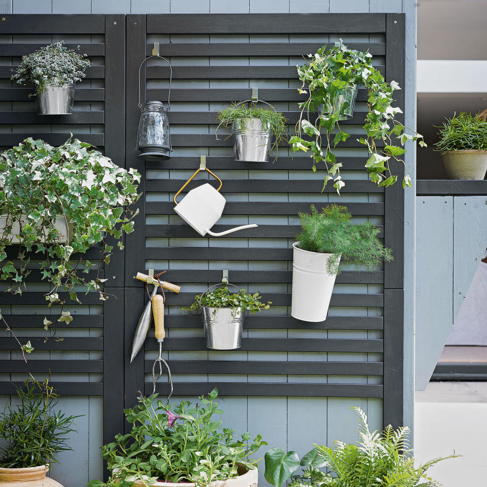 Turn a simple fence into a mini storage place