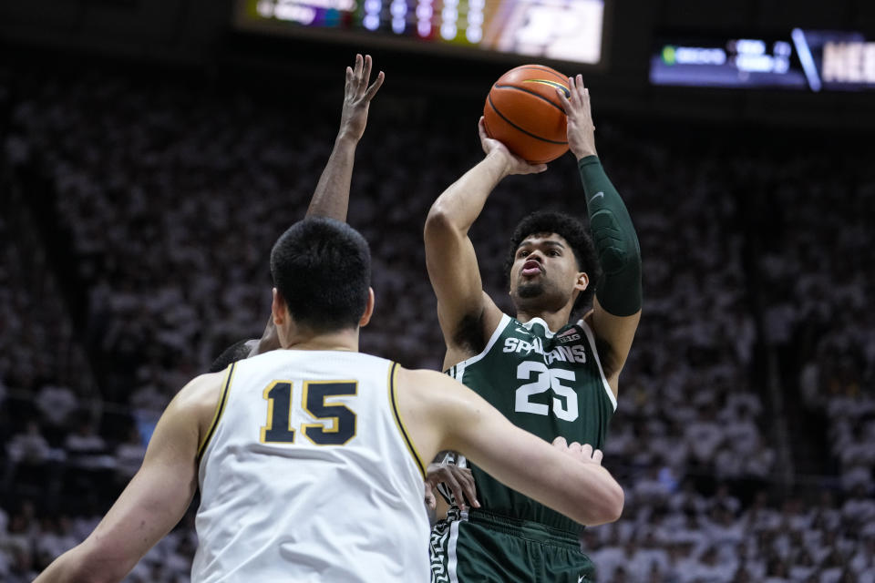 Michigan State forward Malik Hall (25) shoots over Purdue center Zach Edey (15) during the first half of an NCAA college basketball game in West Lafayette, Ind., Sunday, Jan. 29, 2023. (AP Photo/Michael Conroy)