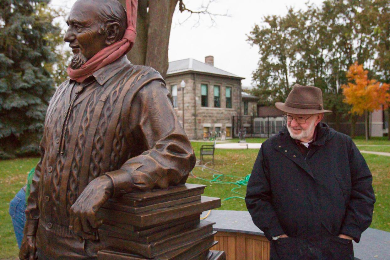 Former city councilmember Steve Manor, who passed away Friday, studies the details of the Zemp Legacy statue as it was being installed at Howell Carnegie District Library, Thursday, Nov. 1, 2018