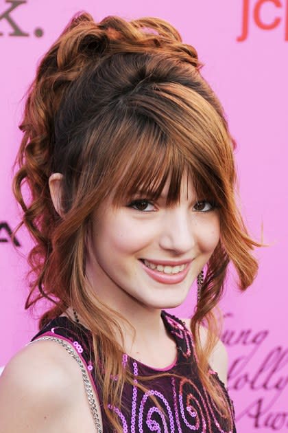 <p><strong>May 2010</strong></p> <p>Here, Bella's switching it up with a country-singer vibe at the 12th Annual Young Hollywood Awards. She pairs a voluminous, curled ponytail and blunt bangs with a touch of black liner, long lashes and monochromatic pink cheeks and lips.</p>