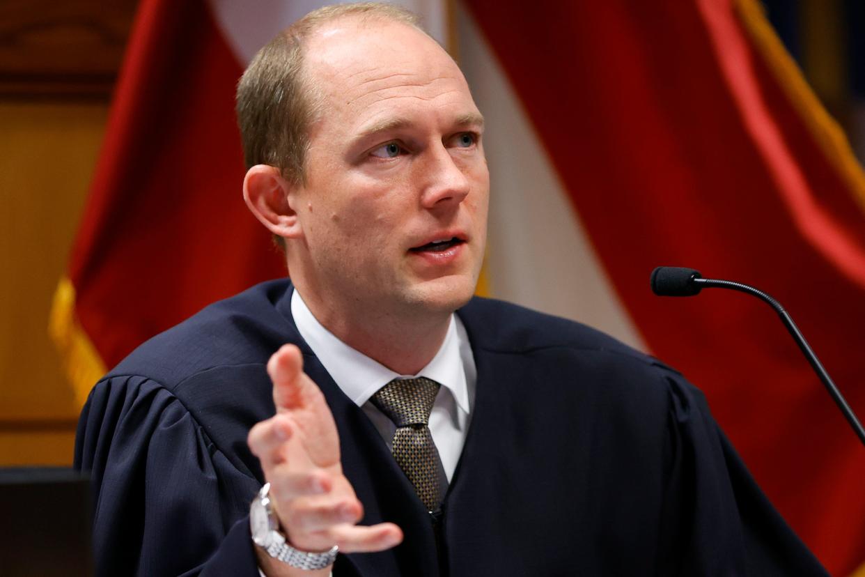 Fulton County Superior Judge Scott McAfee presides in court, Friday, March, 1, 2024, in Atlanta. The hearing is to determine whether Fulton County District Attorney Fani Willis should be removed from the case because of a relationship with Nathan Wade, special prosecutor she hired in the election interference case against former President Donald Trump. (AP Photo/Alex Slitz, Pool) ORG XMIT: GABA122