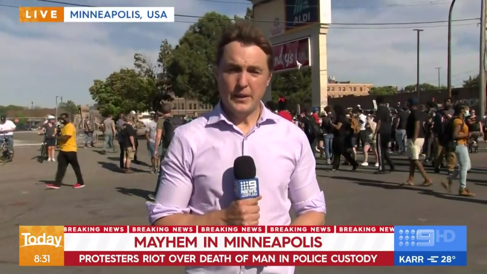 Nine News reporter Tim Arvier at the scene of protests in Minneapolis, USA.