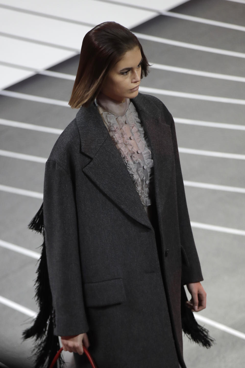 Model Kaia Gerber wears a creation part of the Prada women's Fall-Winter 2020-2021 collection, that was presented in Milan, Italy, Thursday, Feb. 20, 2020. (AP Photo/Luca Bruno).