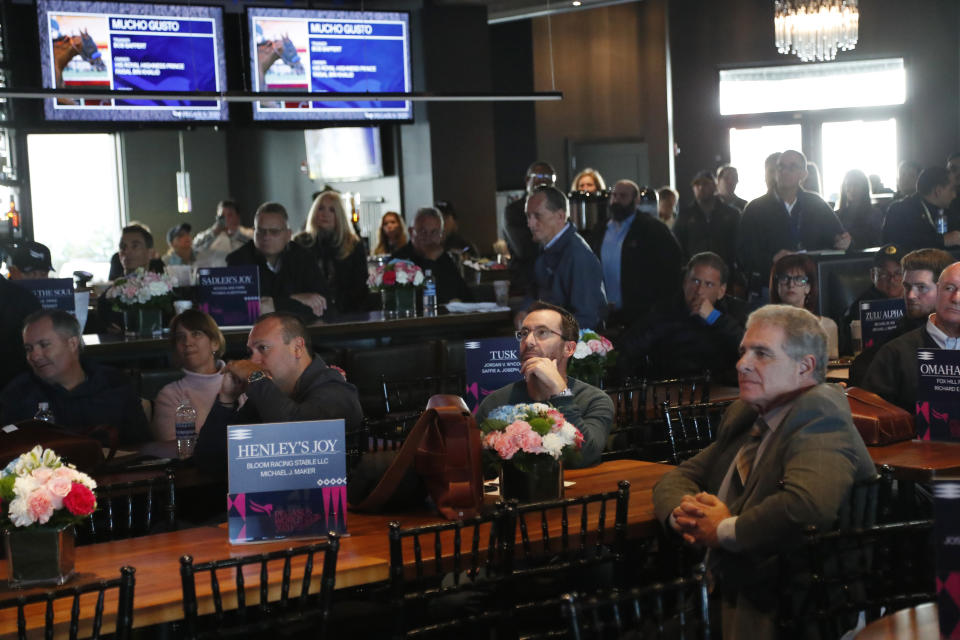 Attendees watch during the draw for the Pegasus World Cup Horse Race, Wednesday, Jan. 22, 2020, in Hallandale Beach, Fla. The race will run Saturday, Jan. 25 at Gulfstream Park in Hallandale Beach. (AP Photo/Wilfredo Lee)