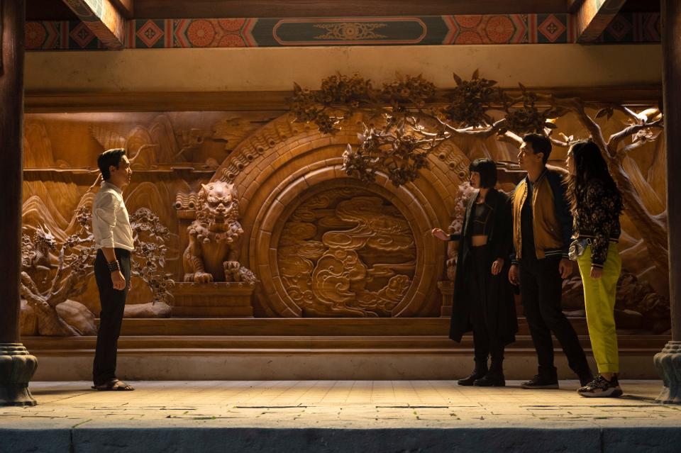 Wenwu (Tony Leung, left) confronts daughter Xialing (Meng’er Zhang), son Shang-Chi (Simu Liu) and Shang-Chi's pal Katy (Awkwafina) in "Shang-Chi and the Legend of the Ten Rings."