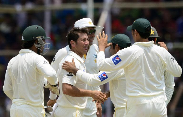 Paksitan's Yasir Shah (2nd L) celebrates with teammates after the dismissal of Bangladesh batsman Tamim Iqbal, during the first day of their first Test match, at The Sheikh Abu Naser Stadium in Khulna, on April 28, 2015