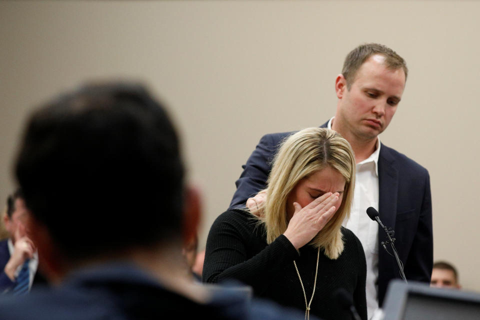 Victim Chelsea Williams, a former gymnast, is comforted by her husband as she speaks during a sentencing hearing for Larry Nassar. (Reuters)