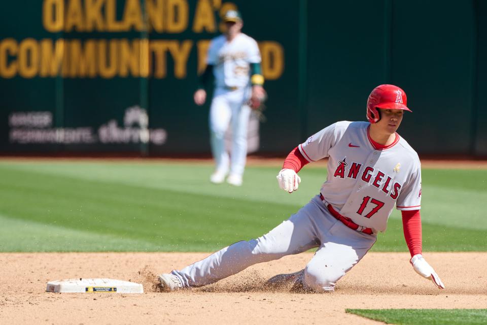 Sep 3, 2023; Oakland, California, USA; Los Angeles Angels designated hitter Shohei Ohtani (17) steals second base against the Oakland Athletics during the fifth inning at Oakland-Alameda County Coliseum. Mandatory Credit: Robert Edwards-USA TODAY Sports