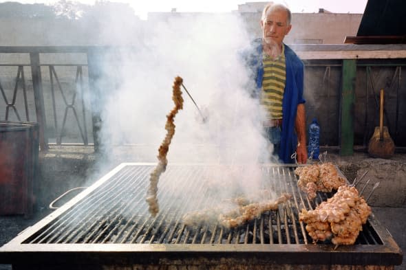 Stigghiolaro, man roasting meat Palermo Sicily Italy