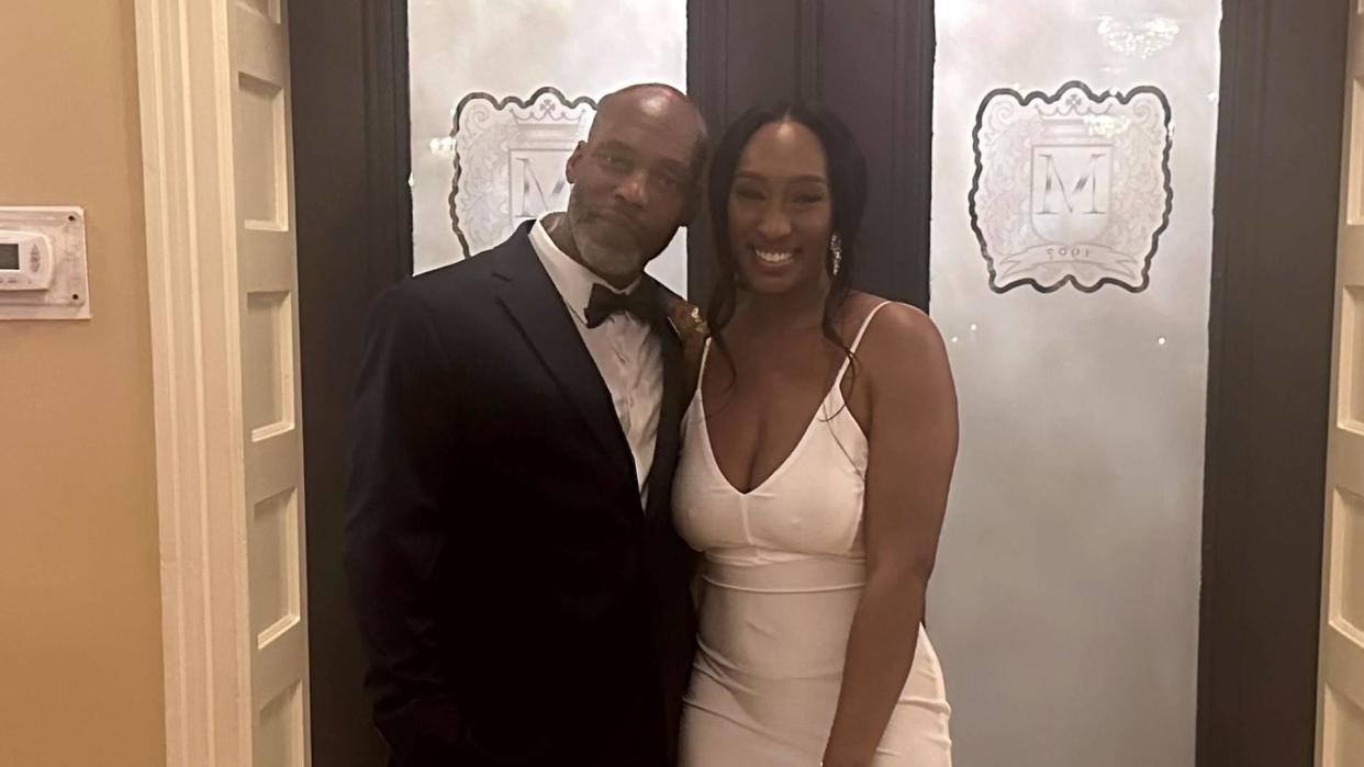 Lamar Johnson with his youngest daughter, Kiera Barrow, on her wedding day. / Credit: Ricky Kidd