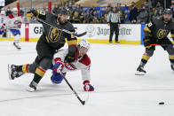 Vegas Golden Knights center Chandler Stephenson (20) and Montreal Canadiens center Jesperi Kotkaniemi (15) battle for the puck as they race down ice during the third period in Game 5 of an NHL hockey Stanley Cup semifinal playoff series Tuesday, June 22, 2021, in Las Vegas. (AP Photo/John Locher)