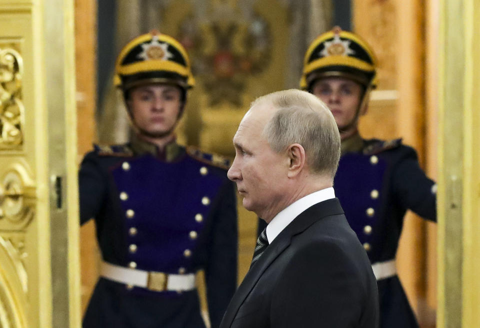 Russian President Vladimir Putin greets senior military officers during a meeting in Moscow, Russia, Wednesday, Nov. 6, 2019. Putin said Russia's new weapons have no foreign equivalents but he insists the country will not use them to threaten anyone. (Mikhail Klimentyev, Sputnik, Kremlin Pool Photo via AP)