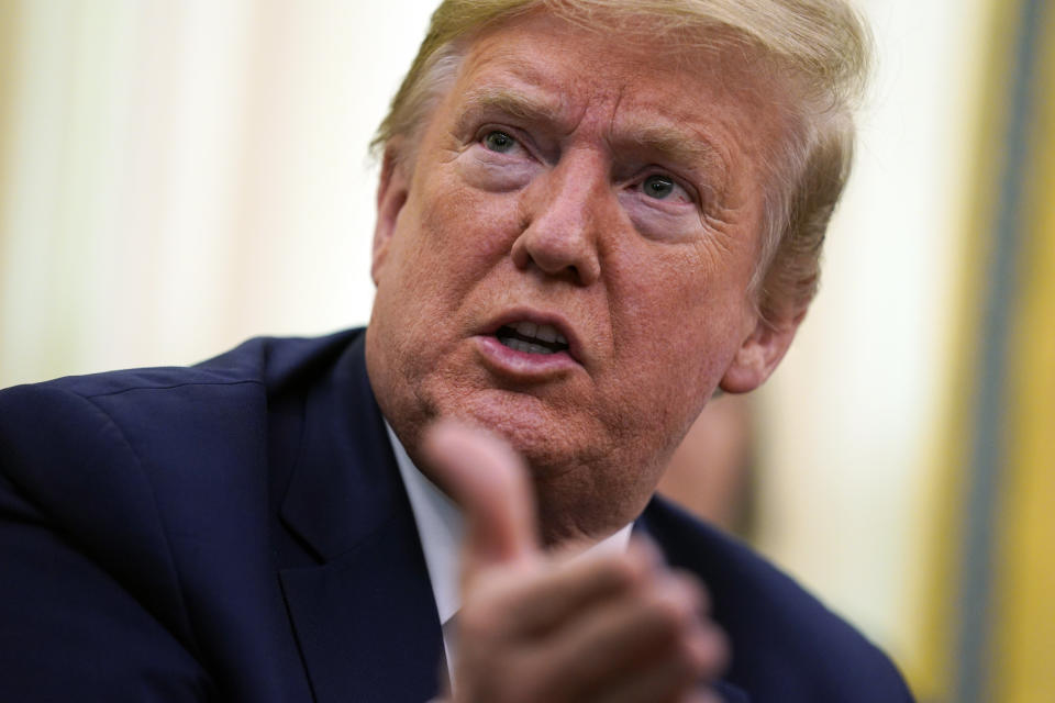 Trump talks to reporters in the Oval Office on May 6. (AP Photo/Evan Vucci)