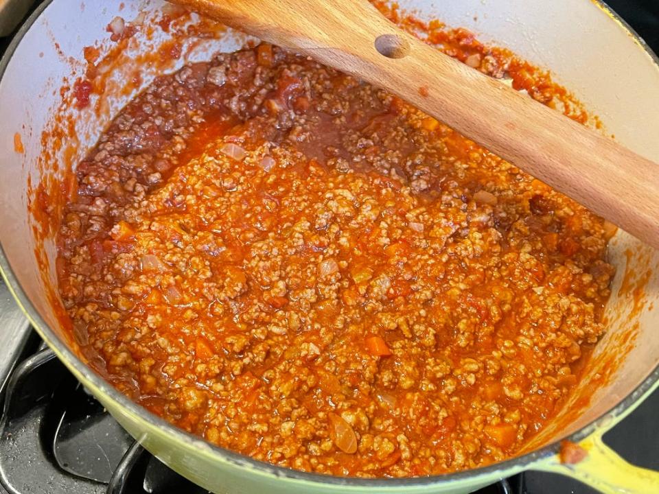 bolognese sauce in a pot on the stove