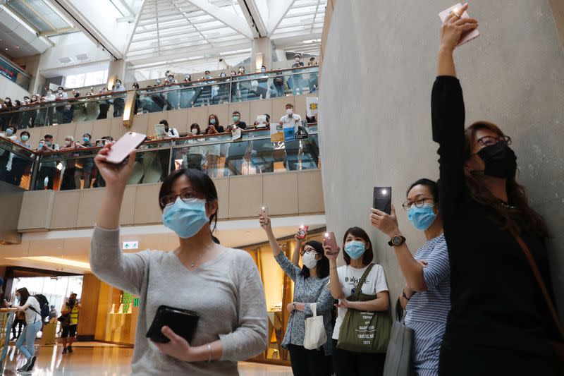 Pro-democracy demonstrators stage a rally at a shopping mall in Hong Kong