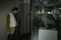 Attik Ullah, 41, from Kandahar stands during his visit at the National Museum of Afghanistan, in Kabul, Monday, Dec. 6, 2021. The National Museum of Afghanistan is open once again -- and the Taliban, whose members once smashed their way through the facility, destroying irreplaceable pieces of Afghanistan's national heritage, now appear to be among its most enthusiastic visitors. (AP Photo/Petros Giannakouris)