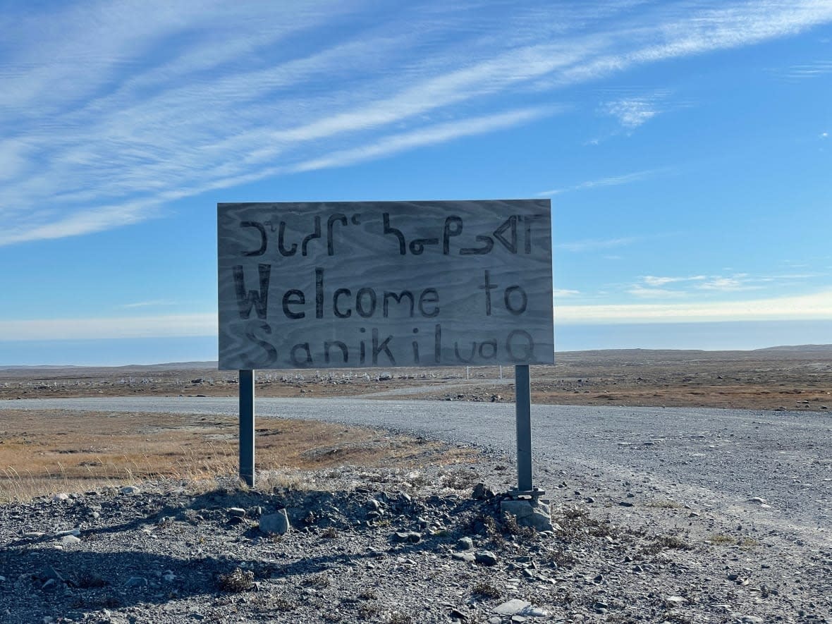 A sign welcoming people to Sanikiluaq, Nunavut, taken in October 2021. The Transportation Safety Board says one person was injured after a King Air B-200 plane overran the runway in the hamlet on Friday morning. (David Gunn/CBC - image credit)