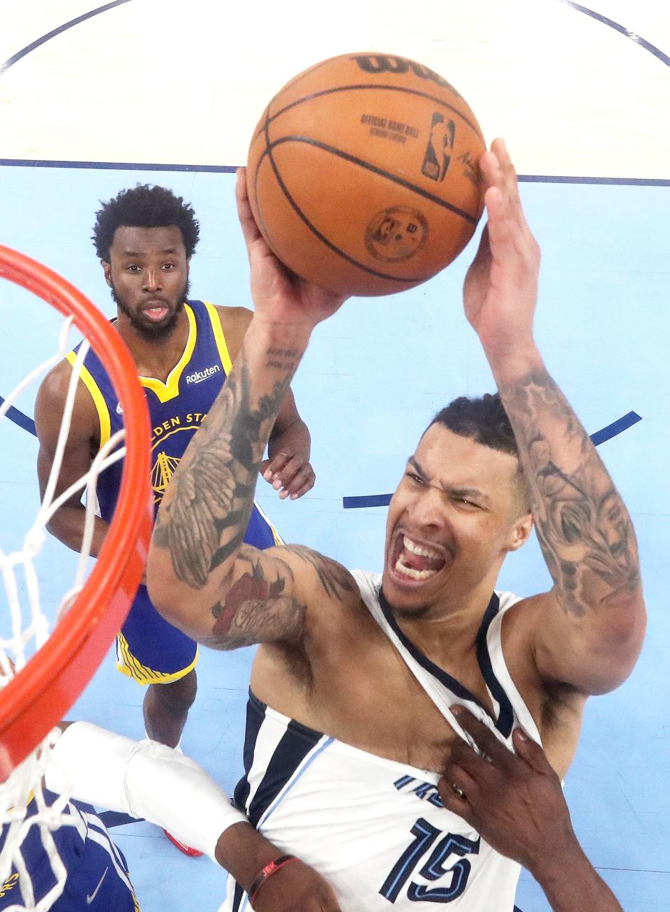 Memphis Grizzlies forward Brandon Clarke is fouled by Golden State Warriors forward Draymond Green during game one of the second round for the 2022 NBA playoffs at FedExForum.