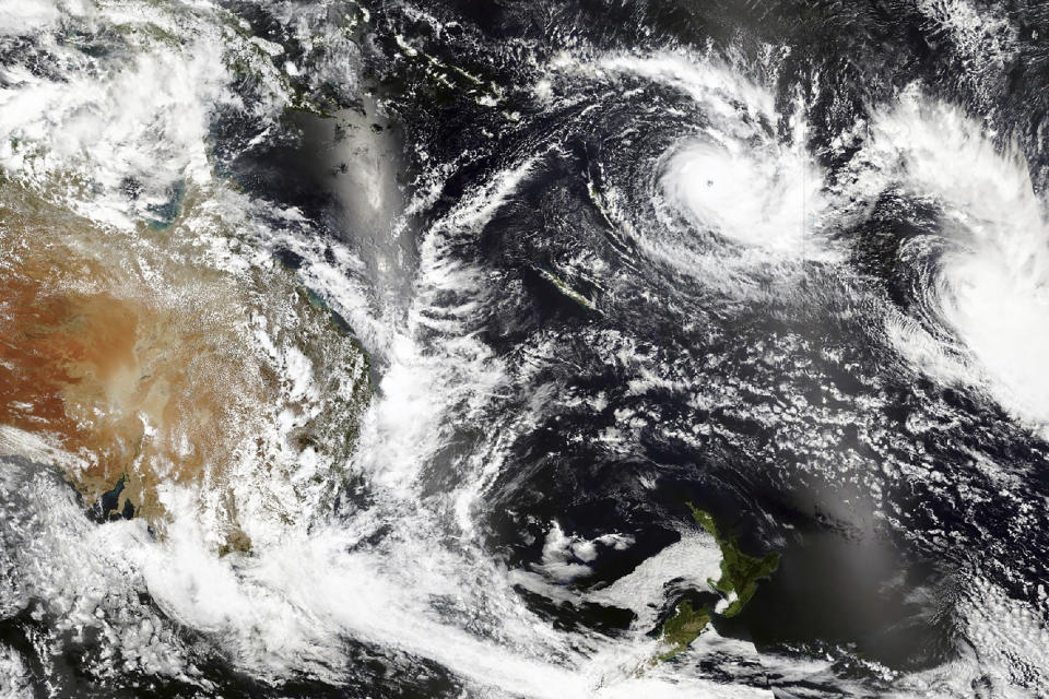 This Tuesday, Dec. 15 2020, satellite image released by NASA Worldview, Earth Observing System Data and Information System (EOSDIS) shows Cyclone Yasa, top center right, over Fiji. Fiji imposed a nationwide curfew Thursday, Dec. 17, 2020 after urging people near the coast to move to higher ground as the island nation prepared for a major cyclone to hit. (NASA via AP)
