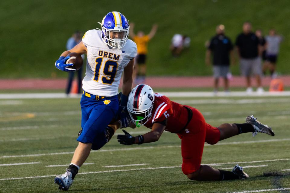 Orem’s Mack Hixson runs the ball at the high school football season opener against East at East High School in Salt Lake City on Friday, Aug. 11, 2023. | Megan Nielsen, Deseret News