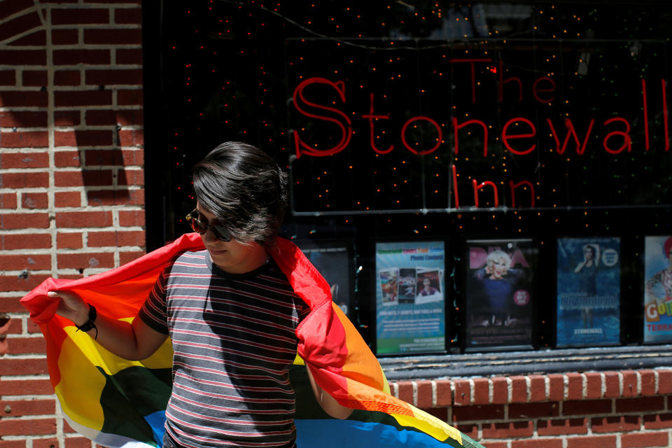 <p>Cameron Cano of Miami, Florida stands outside the Stonewall Inn on Christopher Street, considered by some as the center of New York State’s gay rights movement, following the shooting massacre at Orlando’s Pulse nightclub, in the Manhattan borough of New York, June 12, 2016. (REUTERS/Andrew Kelly ) </p>