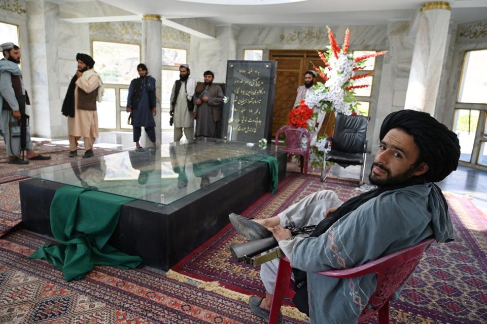 Taliban fighters stand near the tomb of late Afghan Mujahideen leader Ahmad Shah Massoud in Saricha in Panjshir province (AFP via Getty)