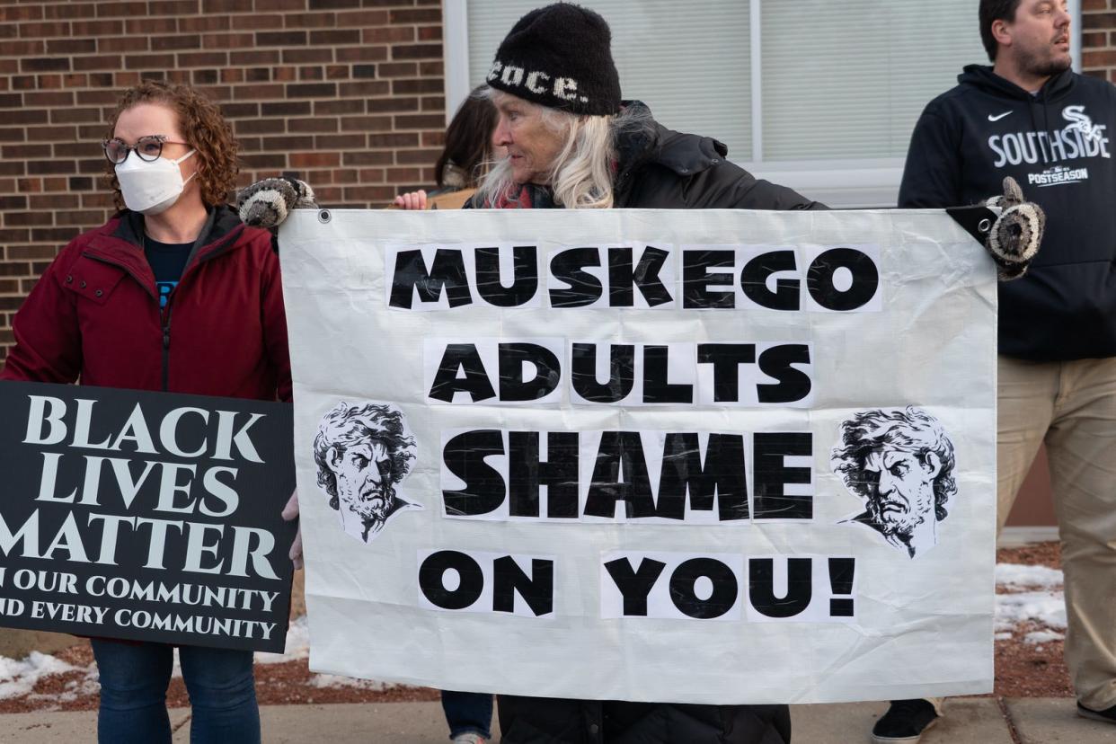 Activist group Overpass Light Brigade helped organize a "Stop Racism" demonstration at a Muskego-Norway School Board meeting on March 13. Protesters, mostly made up of Beloit basketball players' parents, called for change after Beloit Memorial High School basketball players said they faced racism from Muskego High School students at their March 3 playoff game.