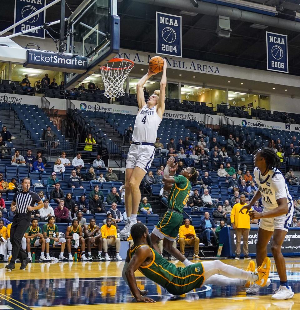 Monmouth's Andrew Ball dunks off a lob pass from Myles Ruth (right) against Norfolk State on Nov. 17, 2022 in West Long Branch.