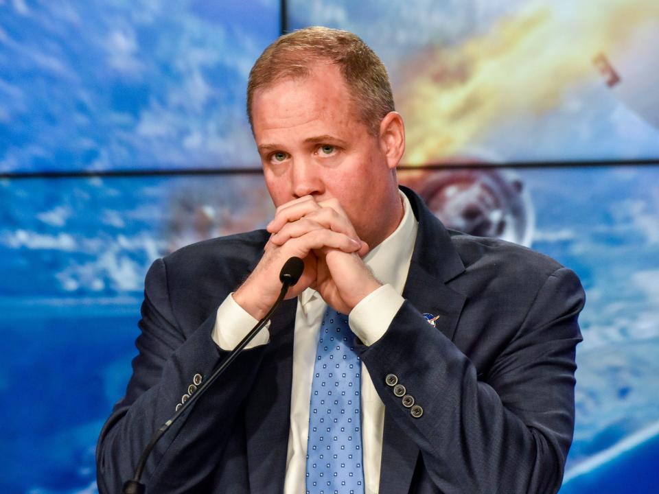 nasa administrator jim bridenstine serious hands clasped expression spacex crew dragon falcon 9 rocket 2020 01 19T174513Z_648793902_HP1EG1J1DBD0Z_RTRMADP_3_SPACE EXPLORATION SPACEX