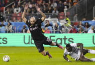 Toronto FC defender Chris Mavinga (23) trips Inter Miami forward Gonzalo Higuaín (10) during the first half of an MLS soccer match Friday, Sept. 30, 2022 in Toronto. (Nathan Denette/The Canadian Press via AP)