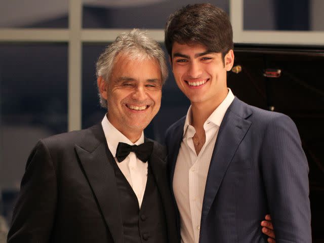 Andrea Bocelli at the piano with his wife Enrica Cenzatti and their son Amos.  The Italian tenor Andrea Bocelli seated at the …