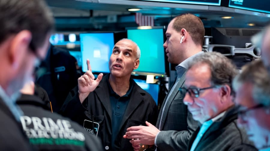 <sub>Traders work on the floor at the New York Stock Exchange in New York, Monday, March 13, 2023.</sub>