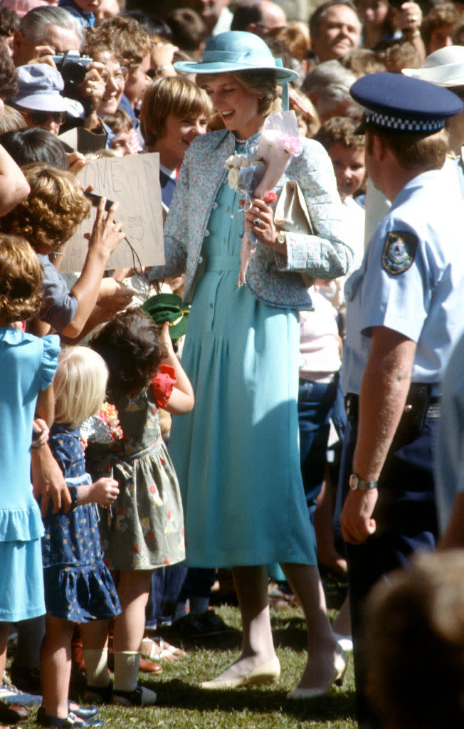 easter outfit fashion style, ALBURY, AUSTRALIA - APRIL 03: Diana, Princess of Wales, wearing a blue and pink floral quilted jacket designed by Miss Antoinette with a turquoise silk dress designed by Jan van Velden and a matching hat with a ribbon streamer, meets children on Easter Sunday at St Matthew's Anglican Church on April 3, 1983 in Albury, Australia. (Photo by Anwar Hussein/Getty Images)