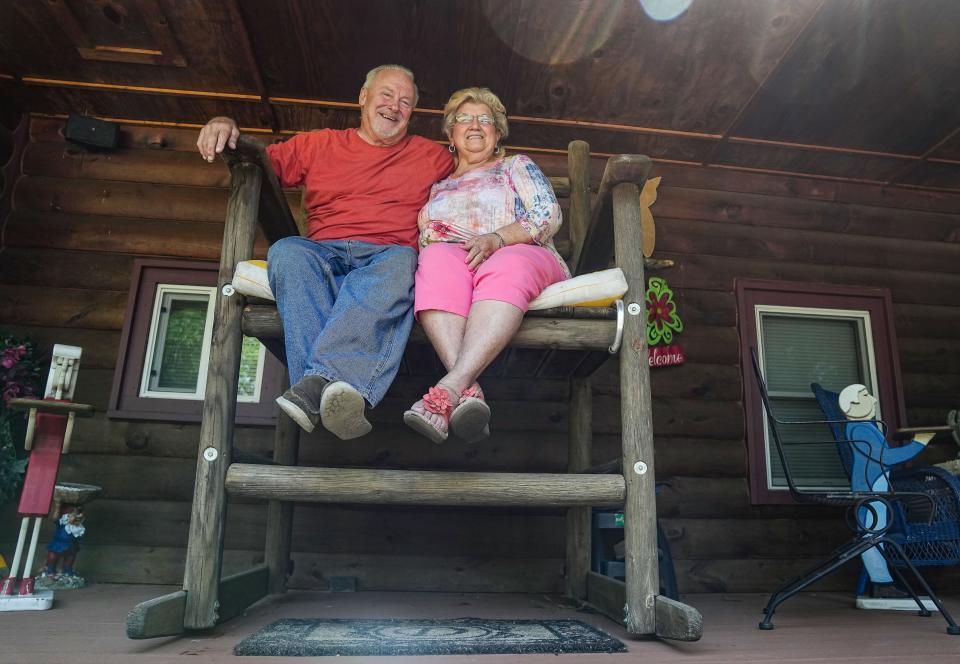 Steve and Louise Deckard sit in a giant rocking-chair Friday, July 28, 2023, at their home in New Bethel, Indianapolis. Steve made the rocking chair for his wife, Louise.