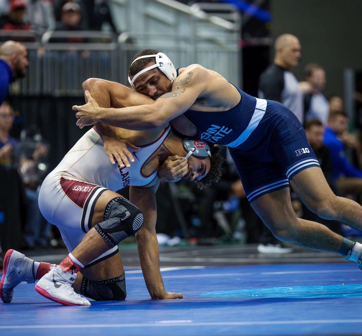 Penn State's Aaron Brook, right, works against Oklahoma’s Stephen Buchanan on his way to a first-period pin at 197 pounds in the quarterfinals of the NCAA Wrestling Championships.