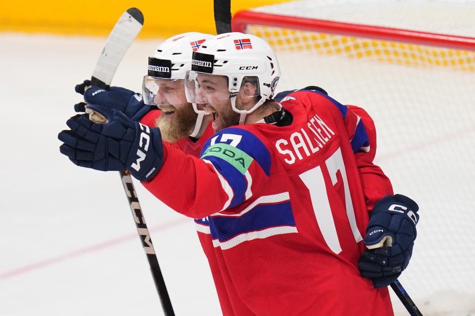 Norway's Eirik Salsten, right, celebrates with Norway's Patrick Thoresen after scoring his sides third goal during the preliminary round match between Czech Republic and Norway at the Ice Hockey World Championships in Prague, Czech Republic, Saturday, May 11, 2024. (AP Photo/Petr David Josek)