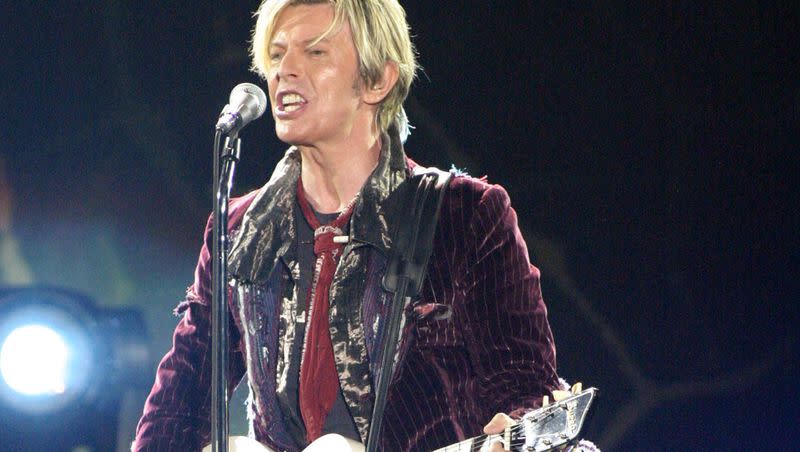 In this May 8, 2004 file photo, David Bowie performs at Chastain Park Amphitheatre in Atlanta.