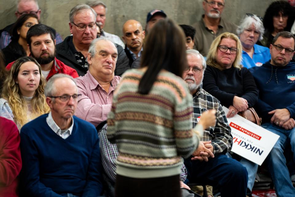 Presidential candidate Nikki Haley speaks to potential voters during a campaign stop in Waukee Sunday, Dec. 10, 2023, at Manning Ag Service.